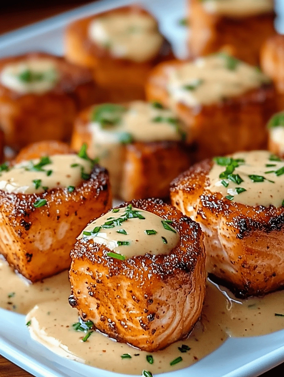 Crispy Bang Bang salmon bites drizzled with sauce and topped with chives