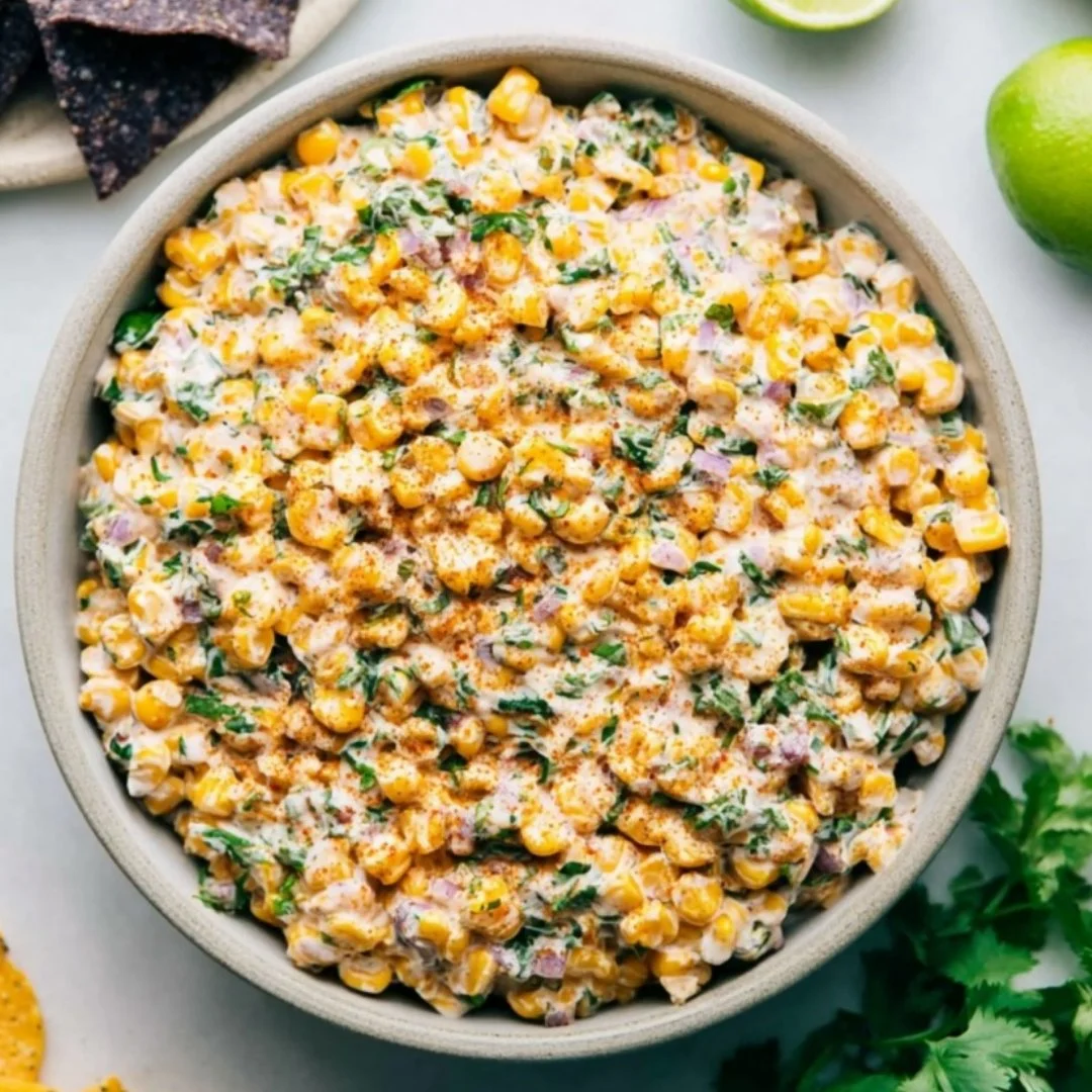 Delicious Mexican street corn dip served in a bowl with toppings