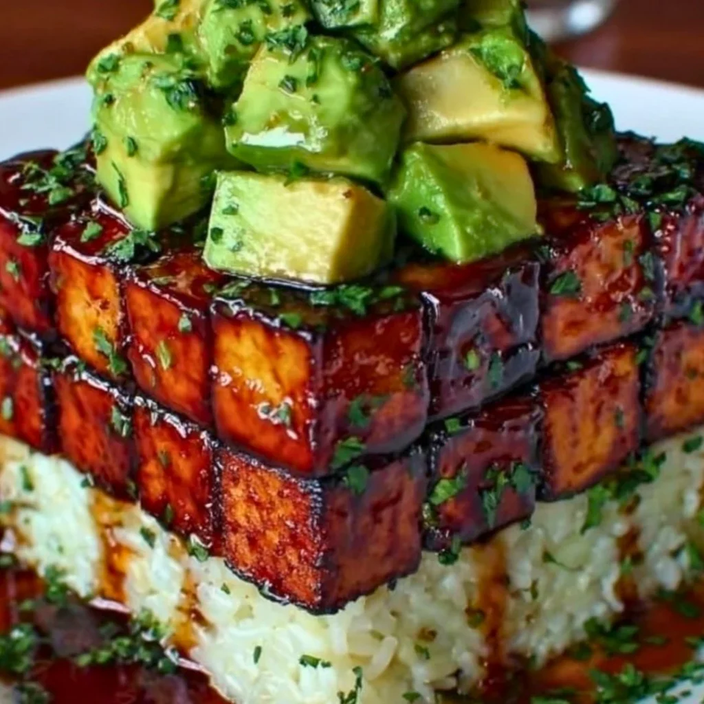 A bright, fizzy blue beverage with granulated salt crystals and a clear jar on a granite surface.