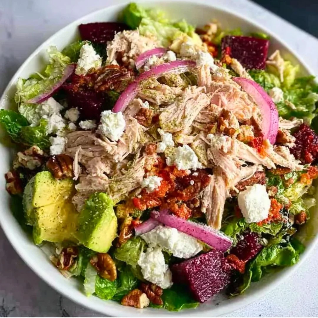 Blue_Salt_Trick_for_Men_Recipe_05 A bright, fizzy blue beverage with granulated salt crystals and a clear jar on a granite surface.