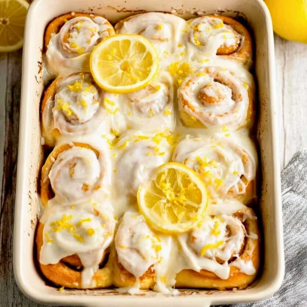 A bright, fizzy blue beverage with granulated salt crystals and a clear jar on a granite surface.