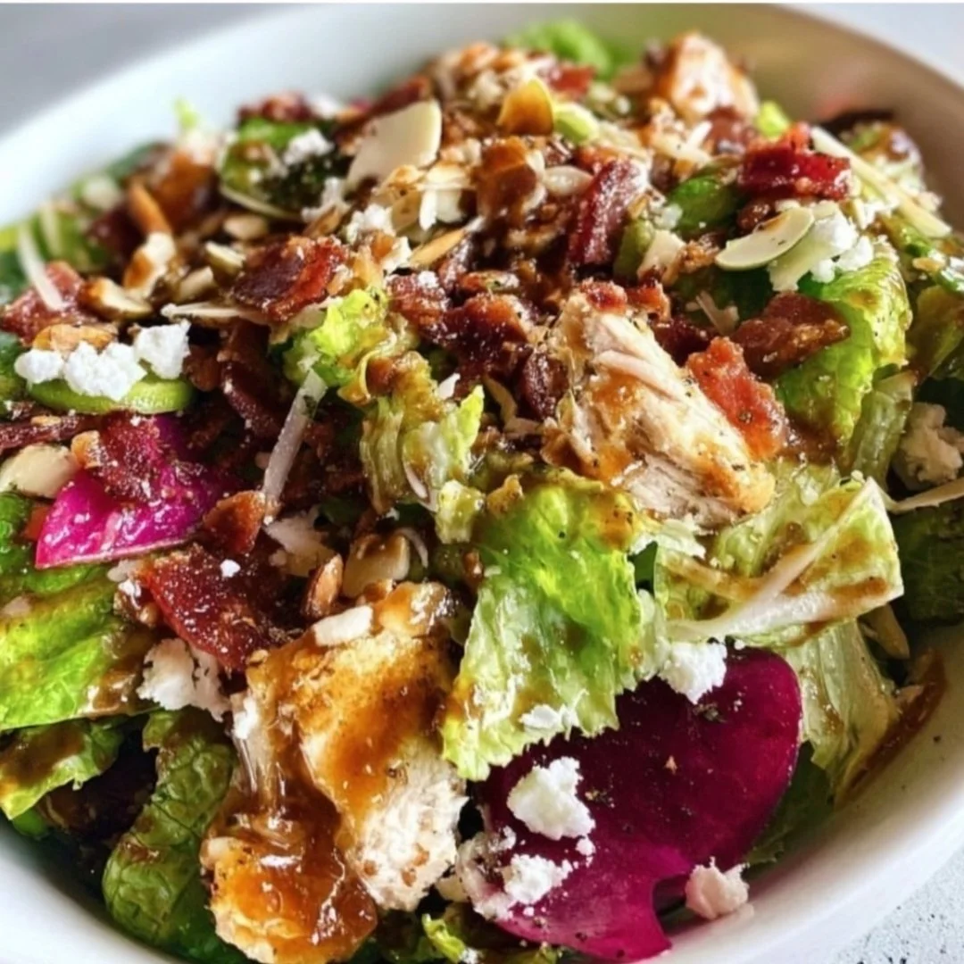A variety of fresh salad recipes beautifully presented on a wooden table.