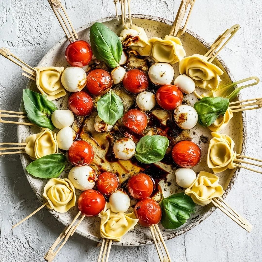 Delicious Caprese Skewers with Tortellini showcasing fresh tomatoes, mozzarella, and basil.